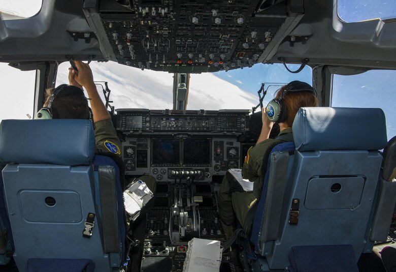 Capt. Keane Carpenter, left, 14th Airlift Squadron C-17 pilot, and Capt. Teri Boivin, right, 14th AS C-17 pilot, fly a C-17 Globemaster III during a cargo drop training exercise at Joint Base Charleston, S.C., May 5, 2017. The 14th AS, 437th Airlift Wing, provides combat-ready aircrews for worldwide, direct-delivery airlift supporting rapid global mobility efforts of the Air Force.