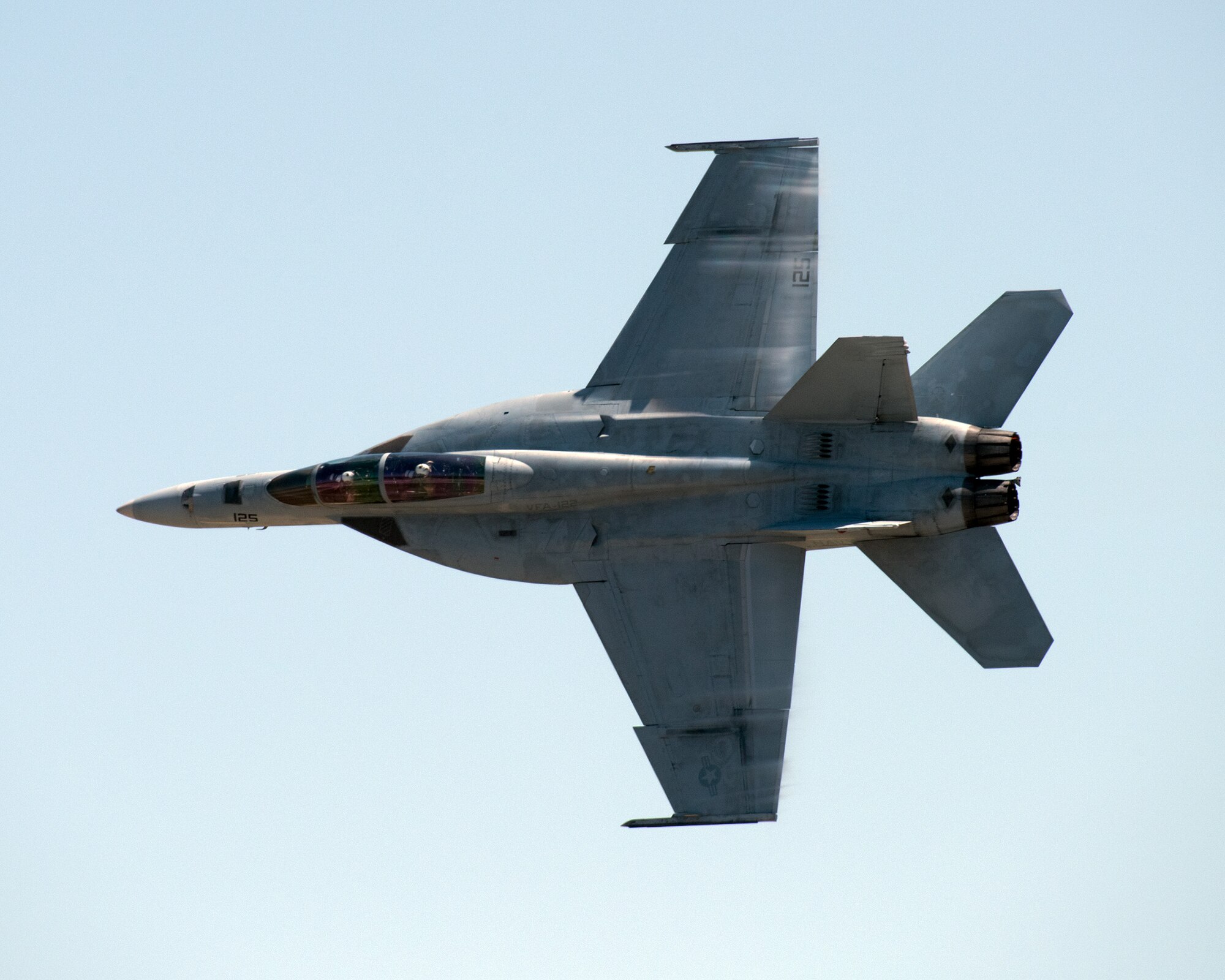 An F-18 Super Hornet performs an aerial demonstration during the Wings over Solano Air Show at Travis Air Force Base, Calif., May 7, 2017. The two-day event was attended by over 50,000 patrons and featured a performance by the U.S. Army Golden Knights parachute team, flyovers and static displays. (U.S. Air Force photo by Louis Briscese)