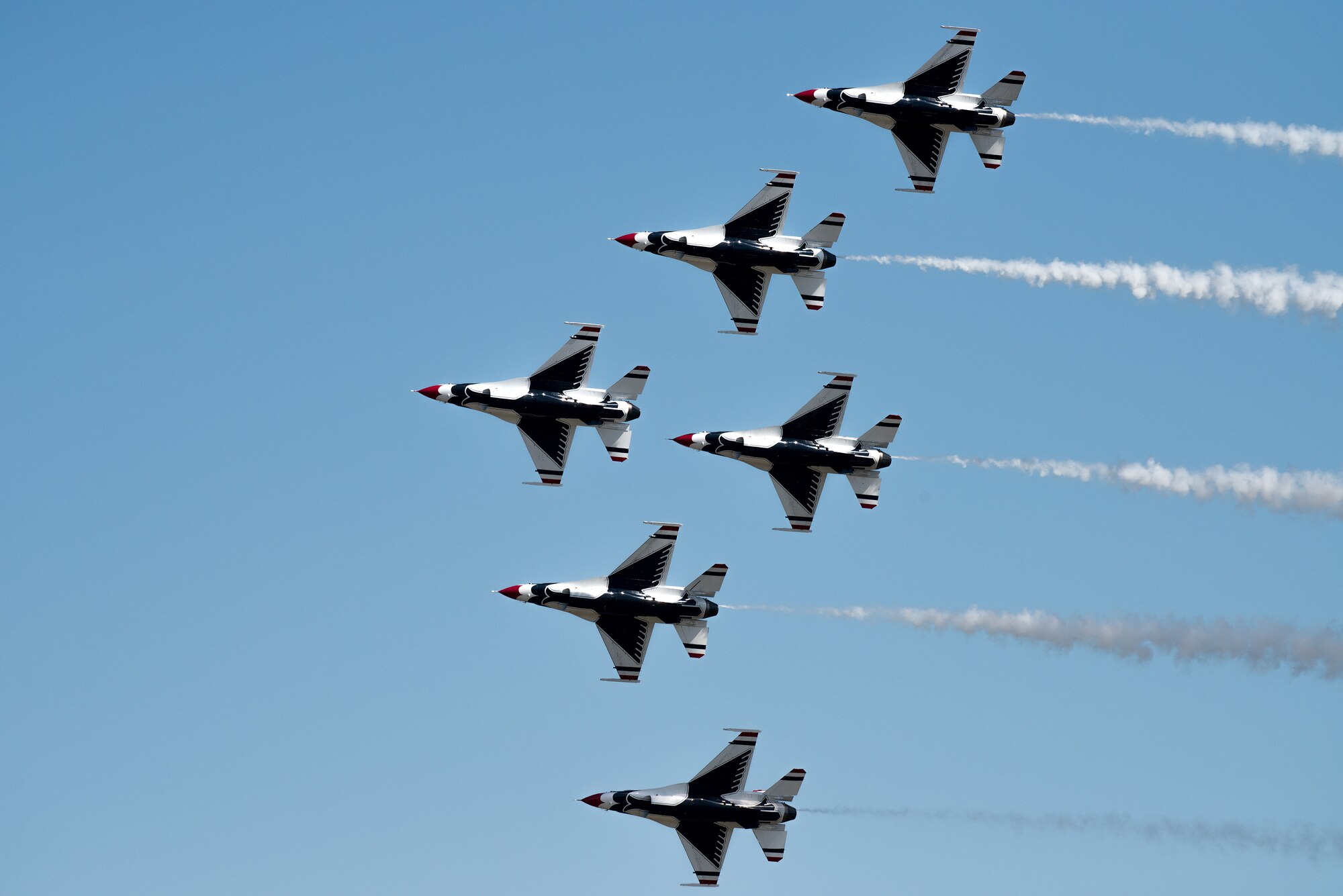 The U.S. Air Force Thunderbirds perform an aerial demonstration during the Wings over Solano Air Show at Travis Air Force Base, Calif., May 7, 2017. The two-day event also featured performances by the U.S. Army Golden Knights parachute team, flyovers and static displays. (U.S. Air Force photo by Louis Briscese)