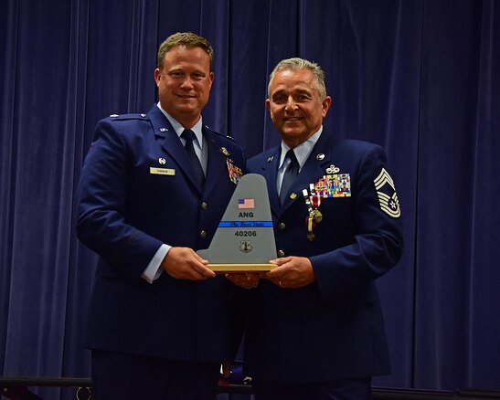 From left, Lt. Col. Lynn Robinson, commander, 166th MXG, presents the 166th Airlift Wing tail-flash to Chief Master Sgt. Henry J. Rome, 166th MXG Superintendent, for over 36 years of military service with the Delaware Air National Guard, the United States Air Force Reserve, the United States Air Force and to the United States of America at the Delaware Air National Guard Base, New Castle, Del., 6 May 2017. (U.S. Air National Guard photo by SSgt. Andrew Horgan/released)