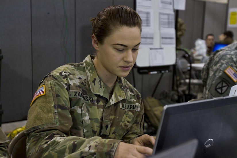 Spc. Jillian L. Zaniewski, a U.S. Army Reserve human resource specialist assigned to Task Force 76 out of Salt Lake City, works on personnel actions during Vibrant Response 17 at Camp Atterbury, Ind., May 7, 2017. Vibrant Response 17 is an annual command post exercise that simulates the detonation of a nuclear bomb in a major city within the United States. This year it was integrated with Guardian Response 17 at Muscatatuck Urban Training Center, Indiana. The exercises enable emergency response organizations, both civilian and military, to integrate and provide relief during a catastrophic disaster. (U.S. Army Reserve Photo by Sgt. Stephanie Ramirez)