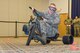 Airman 1st Class Logan Trowbridge, 436th Logistics Readiness Squadron, navigates his tricycle through an obstacle course while wearing “beer goggles” May 5, 2017, at The Landings on Dover Air Force Base, Del. Simulating driving under the influence, Trowbridge and other Team Dover members wore beer goggles at Dover’s Wingman University “You booze, you cruise, you lose” activity. (U.S. Air Force photo by Roland Balik)