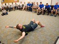 Geoff Borro, 436th Aerospace Medicine Squadron Health Promotions Flight sports dietician, demonstrates Self Myofascial Release techniques using a foam roller for upper back stiffness May 5, 2017, at the Fitness Center on Dover Air Force Base, Del. Borro, also a strength and conditioning coach, taught the “Joint health, stretching & mobility” class during Dover’s Wingman University, under the Comprehensive Airman Fitness “physical” pillar. (U.S. Air Force photo by Roland Balik)