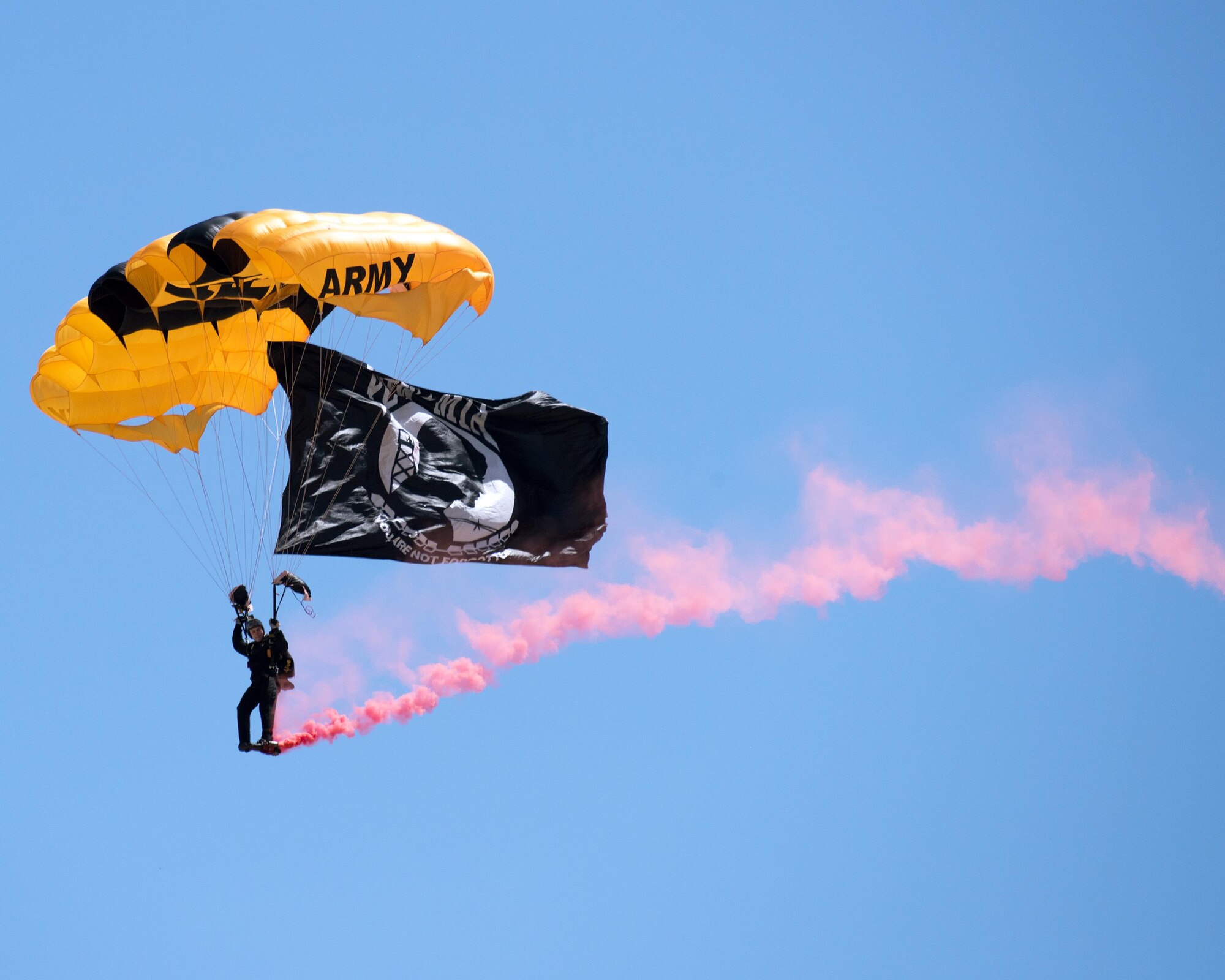 The U.S. Army Golden Knights parachute team performs skydiving maneuvers during the Wings Over Solano Air Show at Travis Air Force Base, Calif., May 7, 2017. The two-day event also featured performances by the U.S. Air Force Thunderbirds Aerial Demonstration Team, flyovers and static displays. (U.S. Air Force photo by Louis Briscese)