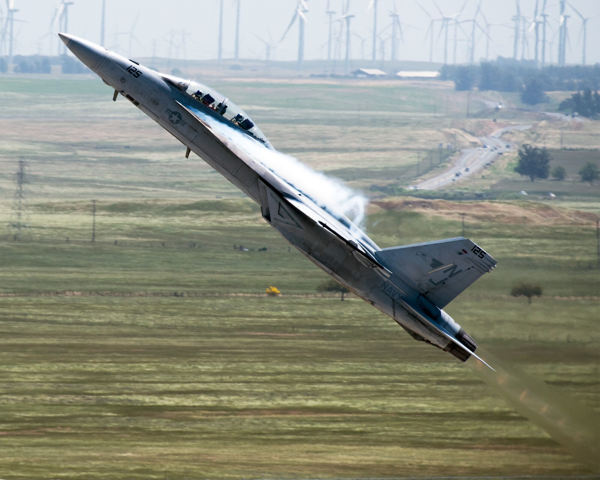 An F-18 Super Hornet performs an aerial demonstration during the Wings over Solano Air Show at Travis Air Force Base, Calif., May 7, 2017. The two-day event was attended by over 50,000 patrons and also featured a performance by the U.S. Army Golden Knights parachute team, flyovers and static displays. (U.S. Air Force photo by Louis Briscese)