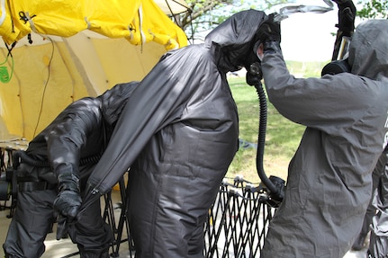 U.S. Army Reserve Soldiers from the 468th Engineer Detachment in Danvers, Massachusetts, go through proper decontamination methods and exiting a simulated contaminated environment on May 6, 2017 at Muscatatuck Urban Training Center, Indiana. Nearly 4,100 Soldiers from across the country are participating in Guardian Response 17, a multi-component training exercise to validate U.S. Army units' ability to support the Defense Support of Civil Authorities (DSCA) in the event of a Chemical, Biological, Radiological, and Nuclear (CBRN) catastrophe.