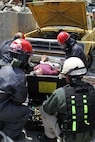 U.S. Army Reserve Soldiers prepare to extract a mannequin victim from underneath a vehicle May 6, 2017 at Muscatatuck Urban Training Center, Indiana. Nearly 4,100 Soldiers from across the country are participating in Guardian Response 17, a multi-component training exercise to validate U.S. Army units' ability to support the Defense Support of Civil Authorities (DSCA) in the event of a Chemical, Biological, Radiological, and Nuclear (CBRN) catastrophe.