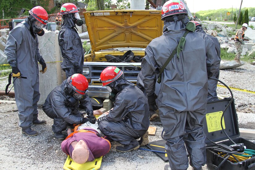 United States Army Reserve Soldiers from Danvers, Massachusetts, based 468th Engineer Detachment treat a mannequin victim extracted from underneath a vehicle May 6, 2017 at Muscatatuck Urban Training Center, Indiana. Nearly 4,100 Soldiers from across the country are participating in Guardian Response 17, a multi-component training exercise to validate U.S. Army units' ability to support the Defense Support of Civil Authorities (DSCA) in the event of a Chemical, Biological, Radiological, and Nuclear (CBRN) catastrophe.