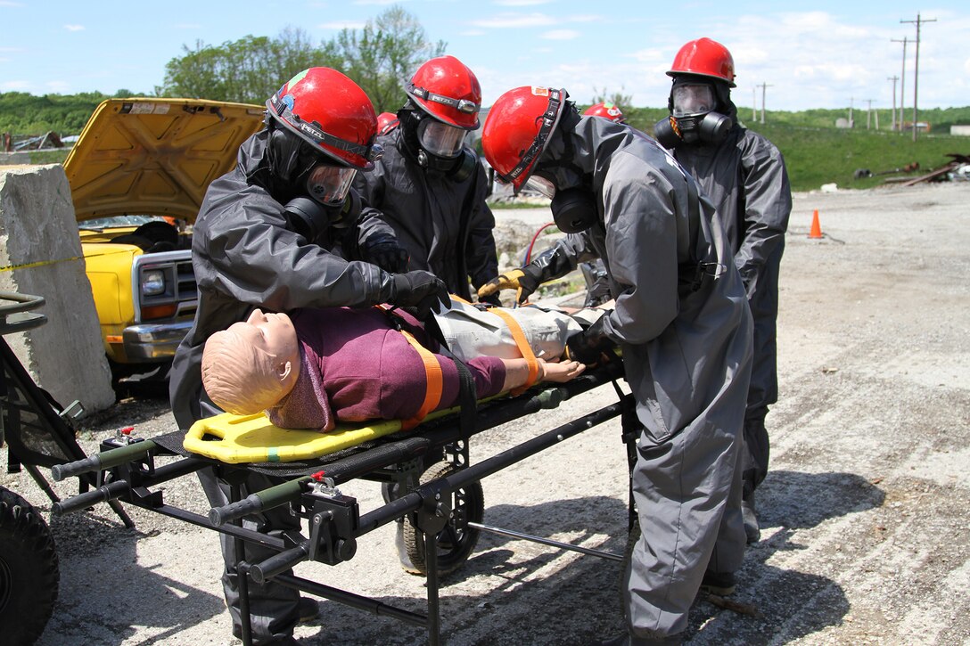 U.S. Army Reseve Soldiers from 468th Engineer Detachment in Danvers, Massachusetts, treat a mannequin victim extracted from underneath a vehicle May 6, 2017 at Muscatatuck Urban Training Center, Indiana. Nearly 4,100 Soldiers from across the country are participating in Guardian Response 17, a multi-component training exercise to validate U.S. Army units' ability to support the Defense Support of Civil Authorities (DSCA) in the event of a Chemical, Biological, Radiological, and Nuclear (CBRN) catastrophe.