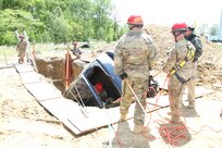 During a specialized form of rescue, Soldiers of the 468th Fire Fighting Detachment engage in one of the most dangerous rescue operations to complete during Guardian Response 17 at Muscatatuck Urban Training Center, Indiana on May 7, 2017.

Nearly 5,000 Soldiers and Airmen from across the country are participating in Guardian Response 17, a multi-component training exercise to validate the military's ability to support Civil Authorities in the event of a Chemical, Biological, Radiological, and Nuclear (CBRN) catastrophe. (U.S. Army Reserve photo by Staff Sgt. Christopher Sofia/Released)