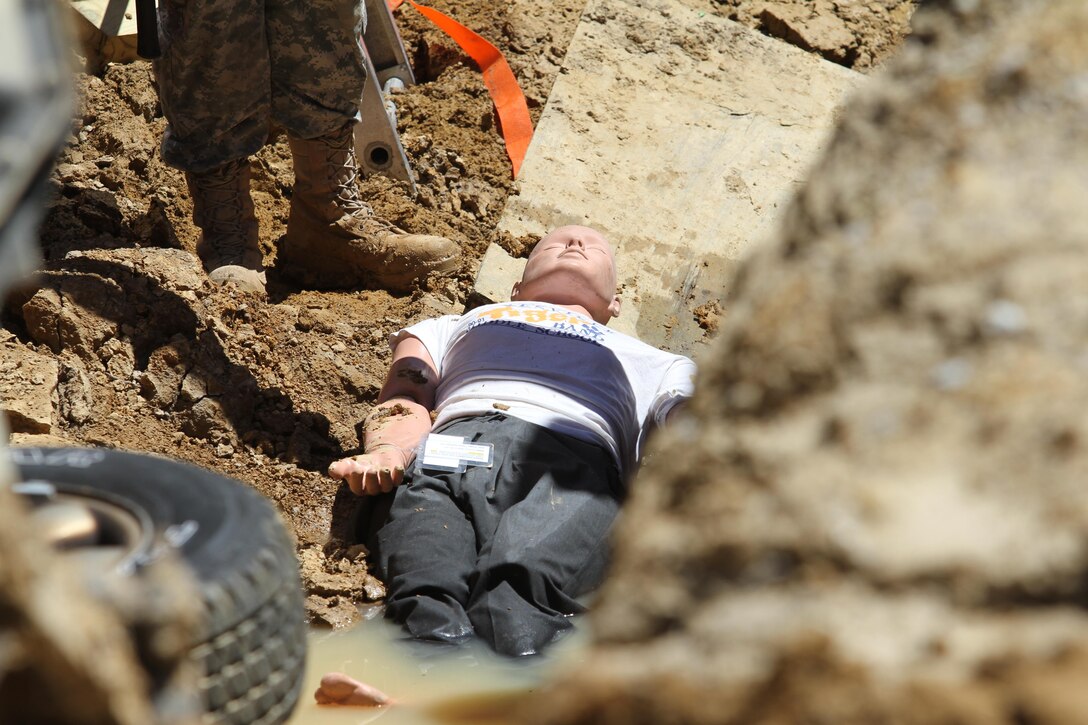 A mannequin lies at the bottom of a trench awaiting rescue during Guardian Response 17 at Muscatatuck Urban Training Center, Indiana on May 7, 2017.

Nearly 5,000 Soldiers and Airmen from across the country are participating in Guardian Response 17, a multi-component training exercise to validate the military's ability to support Civil Authorities in the event of a Chemical, Biological, Radiological, and Nuclear (CBRN) catastrophe. (U.S. Army Reserve photo by Staff Sgt. Christopher Sofia/Released)