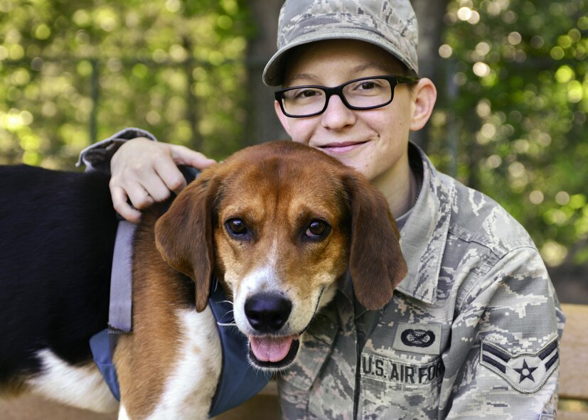 U.S. Air Force Airman 1st Class Kaylee Dubois, 633rd Air Base Wing Public Affairs photojournalist, spends time with her dog, Watson, at Joint Base Langley-Eustis, Va., May 9, 2017. Dubois spent roughly seven months in mental health treatment programs, and once she was successful in managing her own recovery process, she adopted a rescued dog, who now aids in her "self treatment."(U.S. Air Force photo/Tech. Sgt. Katie Gar Ward)