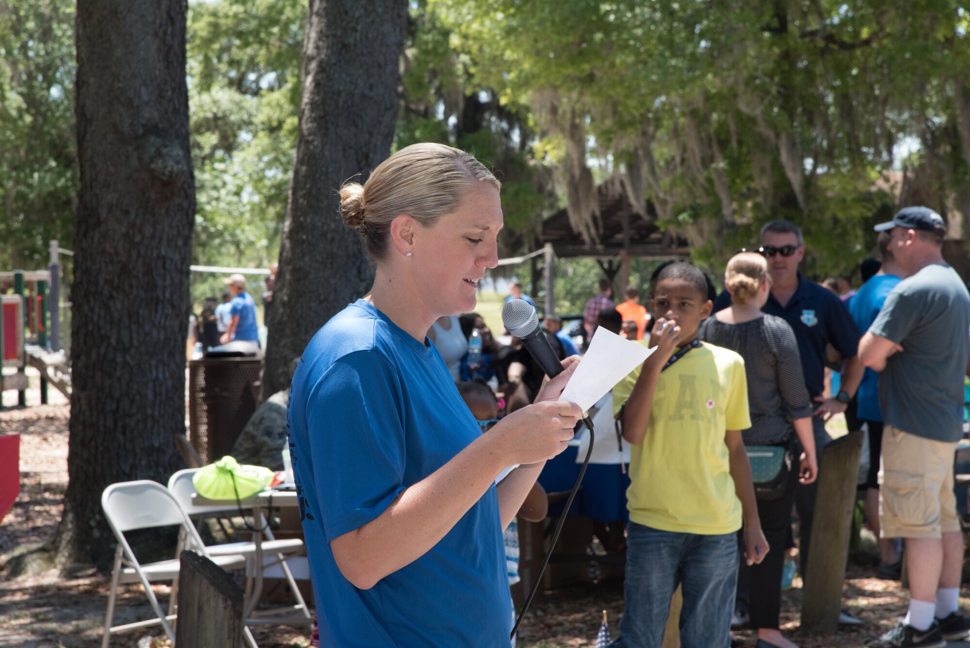 Staff Sgt. Ashley Bever, 403rd Wing Human Resources Development Council vice-chair, reads the names of those who were pied in the face during the 403rd Wing Airman and Family Day picnic May 6, 2017 at Keesler Air Force Base, Mississippi. (U.S. Air Force photo/Maj. Marnee A.C. Losurdo)