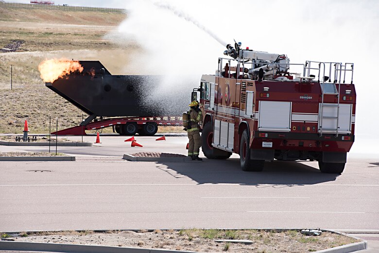 COLORADO SPRINS, Colo – First responders put out a fire on a mock up aircraft that was set ablaze as part of the Freebird 2017 mass casualty exercise in Colorado Springs, Colo., May 5, 2017. The exercise gathered 42 state, county and federal agencies to test crisis preparedness and is a part of a mutual aid agreement between Colorado Springs and Peterson Air Force Base (U.S. Air Force photo by Steve Kotecki)