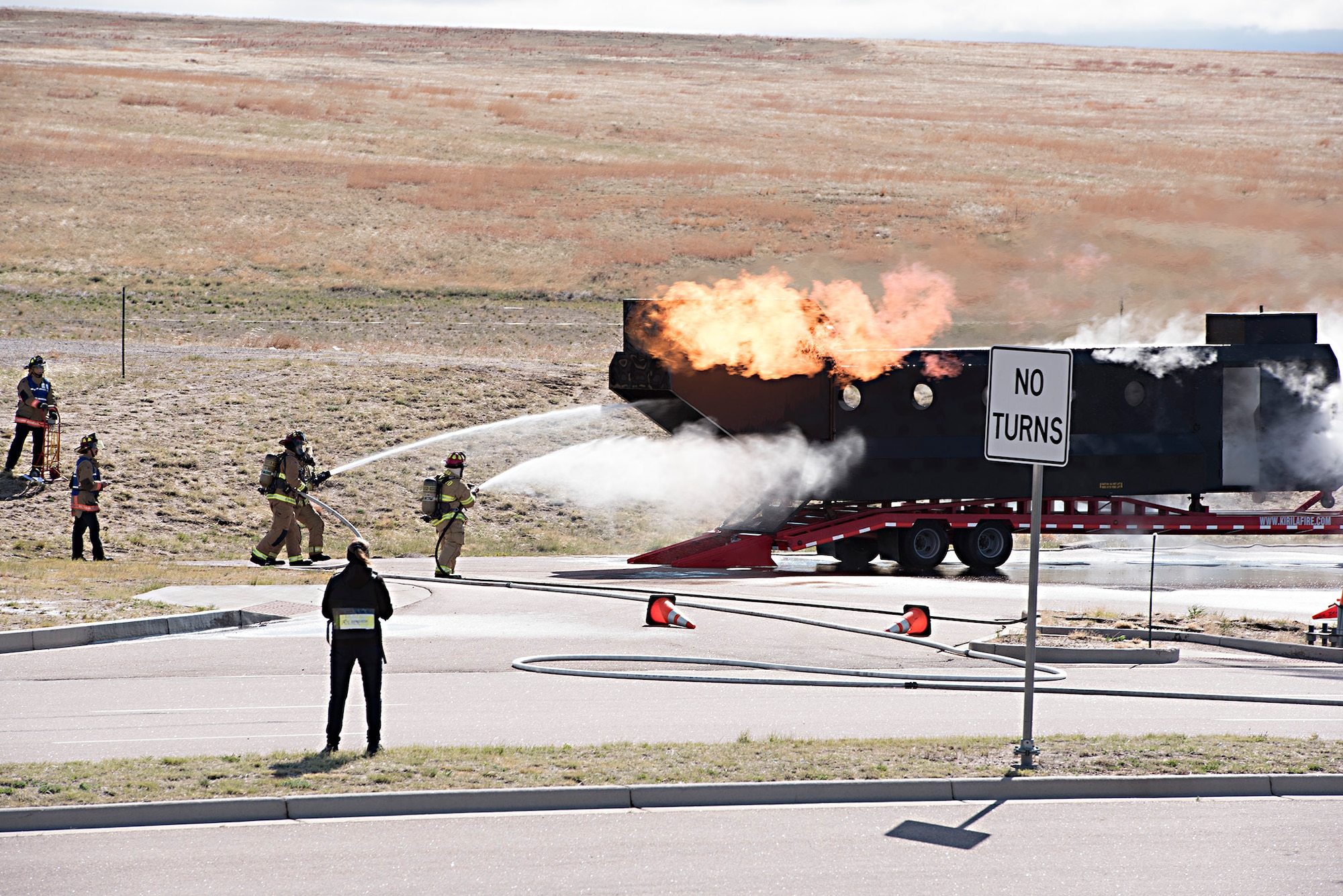 First responders extinguish a fire on a mock up aircraft that was set ablaze as part of the Freebird 2017 mass casualty exercise in Colorado Springs, Colo., May 5, 2017. The exercise gathered 42 state, county and federal agencies to test crisis preparedness. (U.S. Air Force photo by Steve Kotecki)