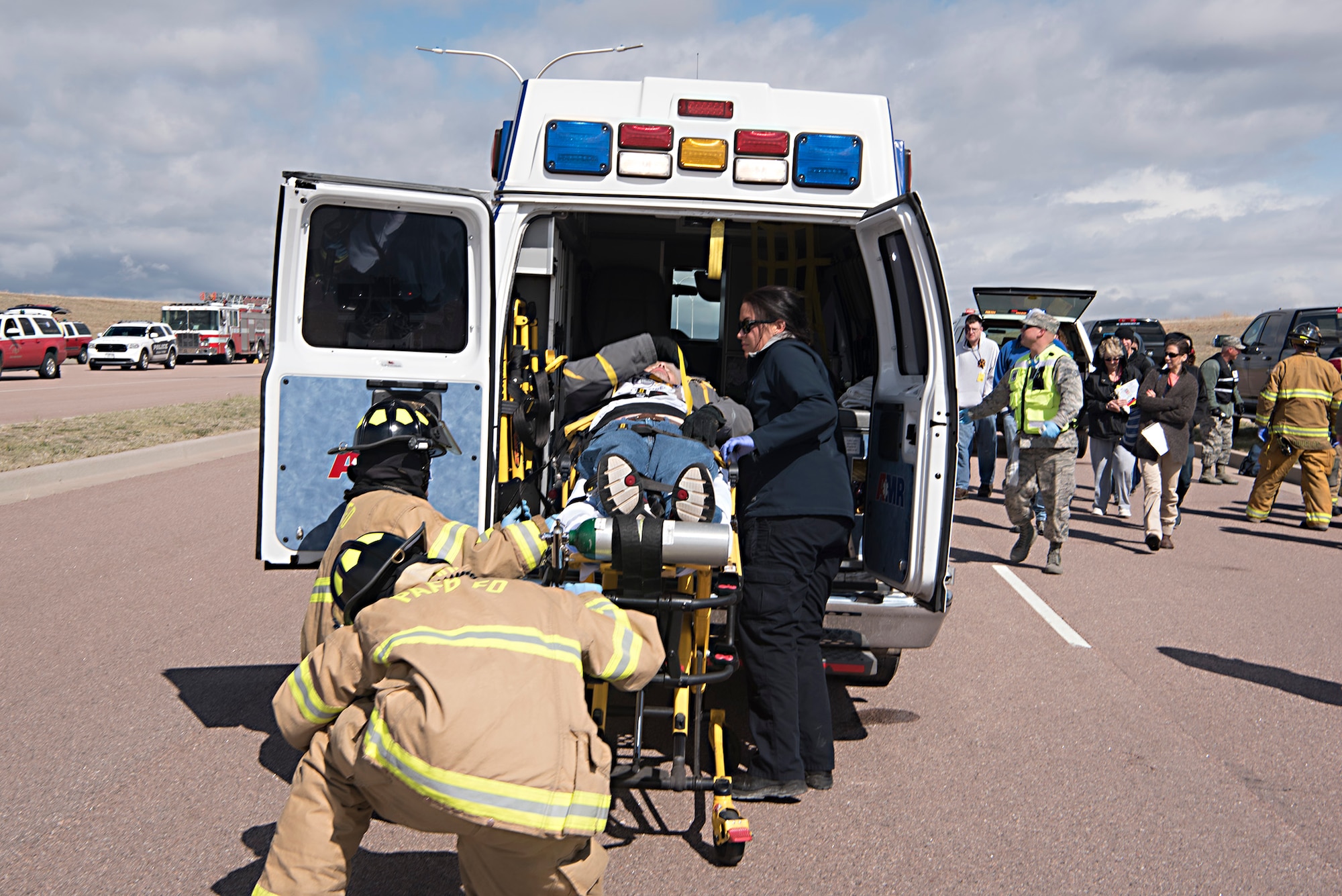 First responders load a simulated victim of an air plane crash into an ambulance during the Freebird 2017 mass casualty exercise in Colorado Springs, Colo., May 5, 2017. The exercise which involved a simulated collision between a Cessna aircraft and Delta Airbus 319, gathered 42 state, county and federal agencies to test crisis preparedness. (U.S. Air Force photo by Steve Kotecki)