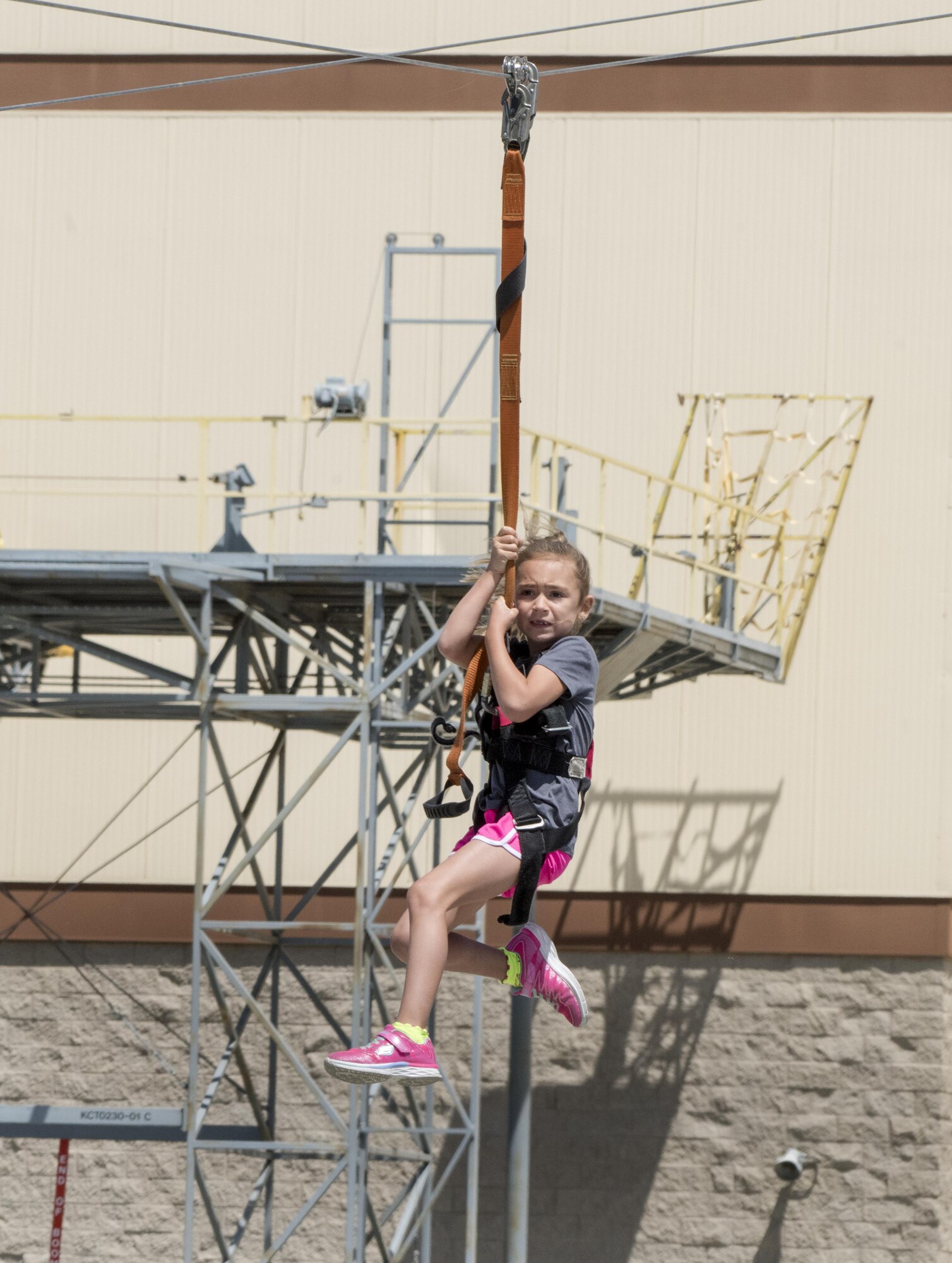 A child trys out the zipline at the Wings Over Solano Air Show at Travis Air Force Base Calif., May 7, 2017. The event featured performances from the U.S. Air Force Thunderbirds Aerial Demonstration Team, U.S. Army Golden Knights parachute teams and civilian perfomers. (U.S. Air Force photo by Heide Couch)