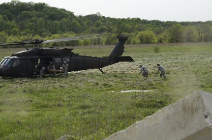 U.S. Army Reserve Soldiers, assigned to the 469th Medical Company-Ground Ambulance out of Wichita, Kansas, and Air Men, assigned to the 6th Medical Operations Squadron out of MacDill Air Force Base in Tampa, Fl., transport casualties from the point of drop off to the Air Force expeditionary medical support tent at forward operating base Nighthawk in Camp Atterbury, In., April 29, 2017, as part of Exercise Guardian Response. Nearly 4,100 Soldiers from across the country are participating in Guardian Response 17, a multi-component training exercise to validate U.S. Army units’ ability to support the Defense Support of Civil Authorities (DSCA) in the event of a Chemical, Biological, Radiological, and Nuclear (CBRN) catastrophe. The 84th Training Command is the hosting organization for this exercise, with the training operations run by the 78th Training Division, headquartered in Fort Dix, New Jersey. (U.S. Army Reserve photo by Capt. Loyal Auterson)