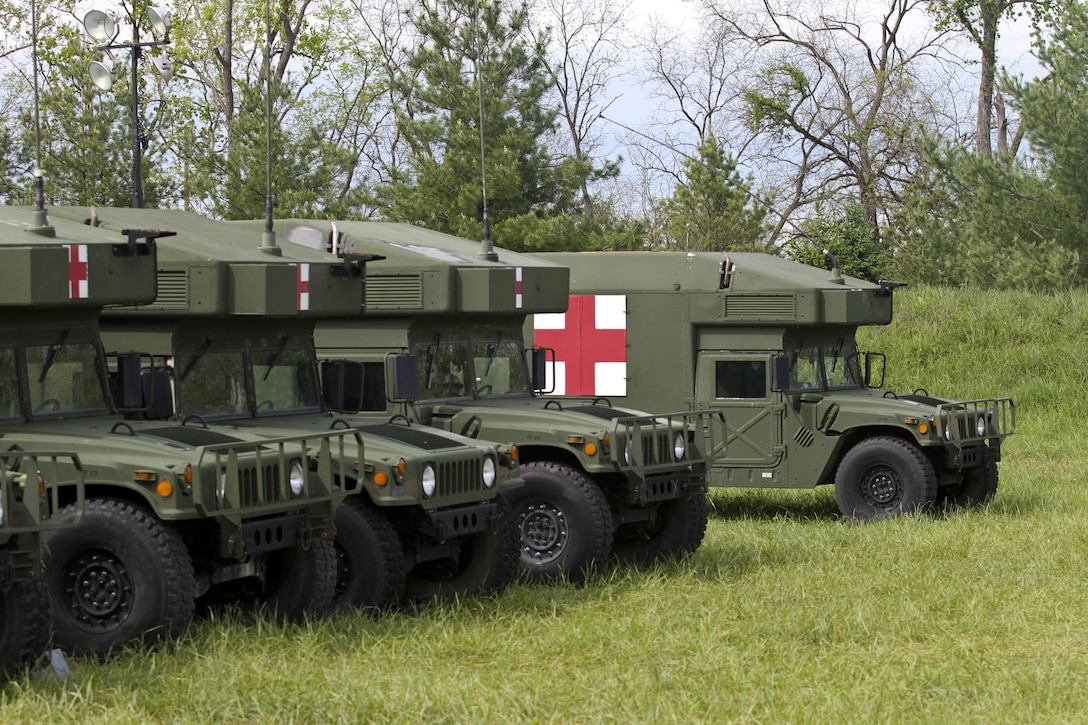 U.S. Army Reserve Soldiers, assigned to the 469th Medical Company-Ground Ambulance out of Wichita, Kansas, and Air Men, assigned to the 6th Medical Operations Squadron out of MacDill Air Force Base in Tampa, Fl., transport casualties from the point of drop off to the Air Force expeditionary medical support tent at forward operating base Nighthawk in Camp Atterbury, In., April 29, 2017, as part of Exercise Guardian Response. Nearly 4,100 Soldiers from across the country are participating in Guardian Response 17, a multi-component training exercise to validate U.S. Army units’ ability to support the Defense Support of Civil Authorities (DSCA) in the event of a Chemical, Biological, Radiological, and Nuclear (CBRN) catastrophe. The 84th Training Command is the hosting organization for this exercise, with the training operations run by the 78th Training Division, headquartered in Fort Dix, New Jersey. (U.S. Army Reserve photo by Staff Sgt. Christopher Sofia)