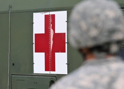 U.S. Army Reserve Soldiers, assigned to the 469th Medical Company-Ground Ambulance out of Wichita, Kansas, and Air Men, assigned to the 6th Medical Operations Squadron out of MacDill Air Force Base in Tampa, Fl., transport casualties from the point of drop off to the Air Force expeditionary medical support tent at forward operating base Nighthawk in Camp Atterbury, In., April 29, 2017, as part of Exercise Guardian Response. Nearly 4,100 Soldiers from across the country are participating in Guardian Response 17, a multi-component training exercise to validate U.S. Army units’ ability to support the Defense Support of Civil Authorities (DSCA) in the event of a Chemical, Biological, Radiological, and Nuclear (CBRN) catastrophe. The 84th Training Command is the hosting organization for this exercise, with the training operations run by the 78th Training Division, headquartered in Fort Dix, New Jersey. (U.S. Army Reserve photo by Staff Sgt. Christopher Sofia)