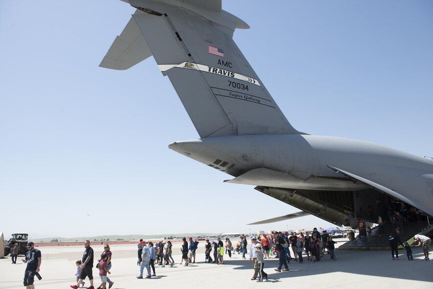 Wings Over Solano Air Show attendees tour a C-17 Globemaster III at Travis Air Force Base Calif., May 7, 2017. The event featured performances from the U.S. Air Force Thunderbirds Aerial Demonstration Team, U.S. Army Golden Knights parachute teams and civilian perfomers. (U.S. Air Force photo by Heide Couch)