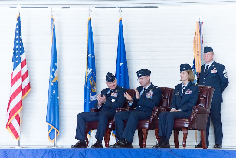 Maj. Gen. John P. Stokes, 22nd Air Force commander and Col. Michael W. Manion, departing 403rd Wing commander, applaud Col. Jennie R. Johnson, incoming 403rd Wing commander, during the 403rd Wing change of command ceremony May 7, 2017 at Keesler Air Force Base, Mississippi. (U.S. Air Force photo/Staff Sgt. Heather Heiney)