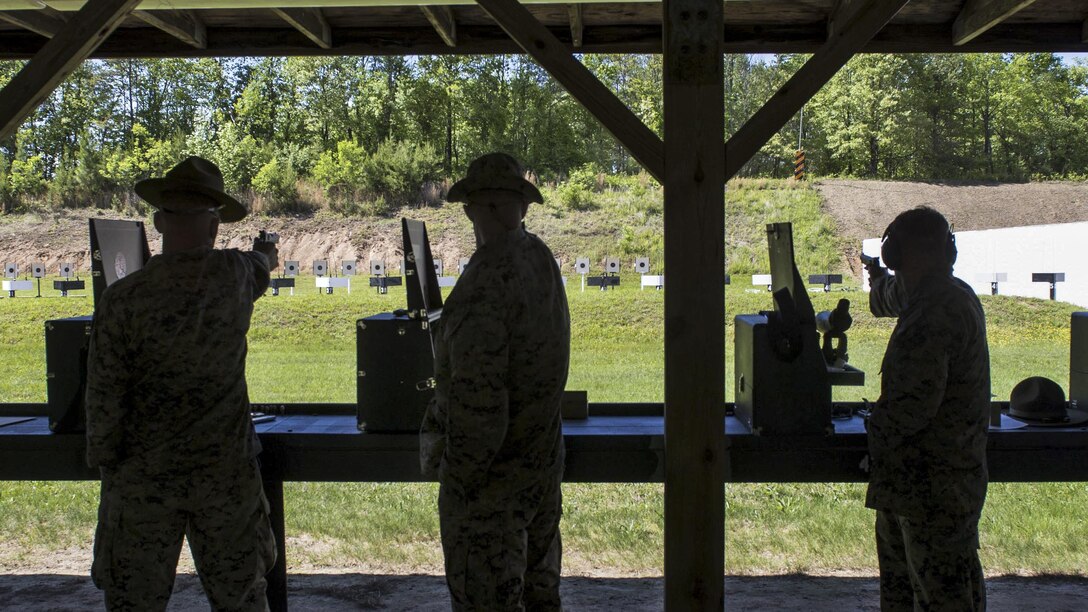 Marines fire down the pistol range during the Marine Corps Shooting Team Championships on Marine Corps Base Quantico, Va., May 3, 2017. Regional Marine Corps marksmanship medalists come together each year at the championship to compete in individual and team matches. Marine Corps photo by Lance Cpl. Erasmo Cortez III  
