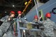 Airmen assigned to the 432nd Maintenance Squadron lift the wings of the MQ-9 Reaper model May 5, 2017, at Travis Air Force Base, Calif. 432nd MXG maintainers used jacks in order to secure and transport the wings during the build before the 2017 Wings over Solano air show. (U.S. Air Force photo/Airman 1st Class James Thompson)