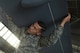 Senior Airman Paulino holds an MQ-9 Reaper model wing steady while a team of seven airmen with the 432nd Maintenance Squadron insert it into the fuselage of the display. The maintenance crew was tasked with unloading, building and maintaining the model for the 2017 Wings over Solano air show. (U.S. Air Force photo/Airman 1st Class James Thompson)