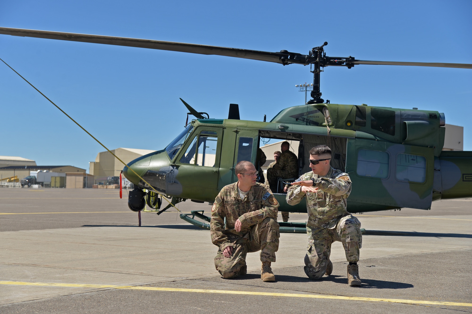 Staff Sgt. Jonathan Kitts, 741st Missile Security Forces Squadron Tactical Response Force flying program manager, right, trains Senior Airman Robert Darcy, 741st MSFS Convoy Response Force defender, during joint fires observer training May 8, 2017, at Malmstrom Air Force Base, Mont. JFO training for the CRF team allows the trained members to request, control and adjust surface-to-surface gun fire, provide air support targeting information and maintain communication with aircrew and the airborne fire team inside a support helicopter. (U.S. Air Force photo/Airman 1st Class Daniel Brosam)