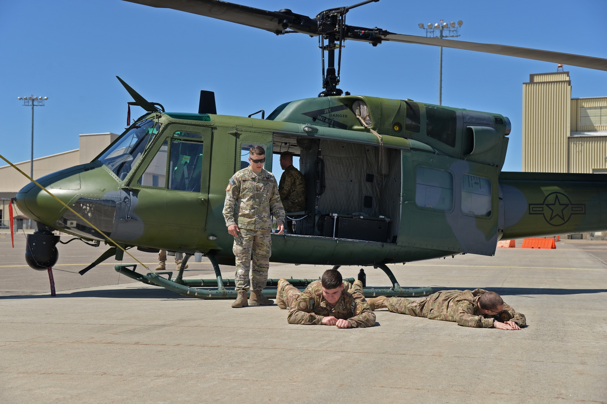 Staff Sgt. Jonathan Kitts, 741st Missile Security Forces Squadron Tactical Response Force flying program manager, left, trains Airman 1st Class Luke Gorst, 741st MSFS defender, center, and Senior Airman Robert Darcy, 741st MSFS Convoy Response Force defender, during joint fires observer training May 8, 2017, at Malmstrom Air Force Base, Mont. JFO training consists of Airmen traveling to Fort Sill, Oklahoma, for two weeks to learn to communicate over radios, assess ranges of targets, properly read a map and call for different close air support, whether working with the Army, Navy, Marines or Coast Guard, or receiving support from aircraft or ships. The members then come back to Malmstrom for more training to learn additional tools and techniques centric to the base’s mission. (U.S. Air Force photo/Airman 1st Class Daniel Brosam)