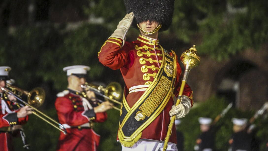 Marine Corps Master Sgt. Duane King, a drum major with “The President’s Own," the Marine Corps Band, salutes the hosting official and guests of honor during a concert at Marine Barracks Washington D.C., May 5, 2017. Marine Corps photo by Lance Cpl. Damon Mclean