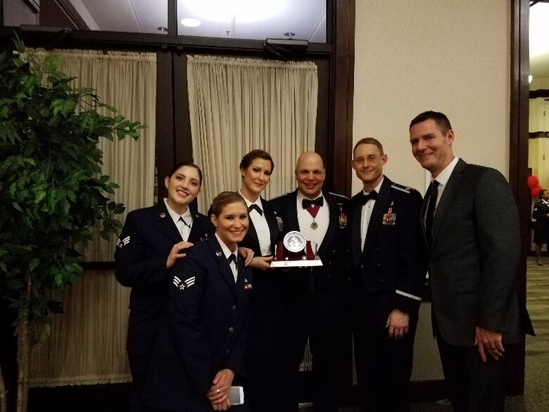 Members of the Clinical Investigation Facility at Travis Air Force Base, Calif., pose with the 2016 60th Air Mobility Wing Team of the Year award. The CIF won the award for its mission contribution to developing the REBOA technique for worldwide use. (Courtesy photo)