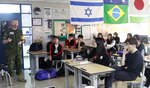 Commander Robert J. Watt, chief of staff of United Nations Command Military Armistice Commission talks with students attending Model United Nations activity at Yongsan International School of Seoul, April 21.