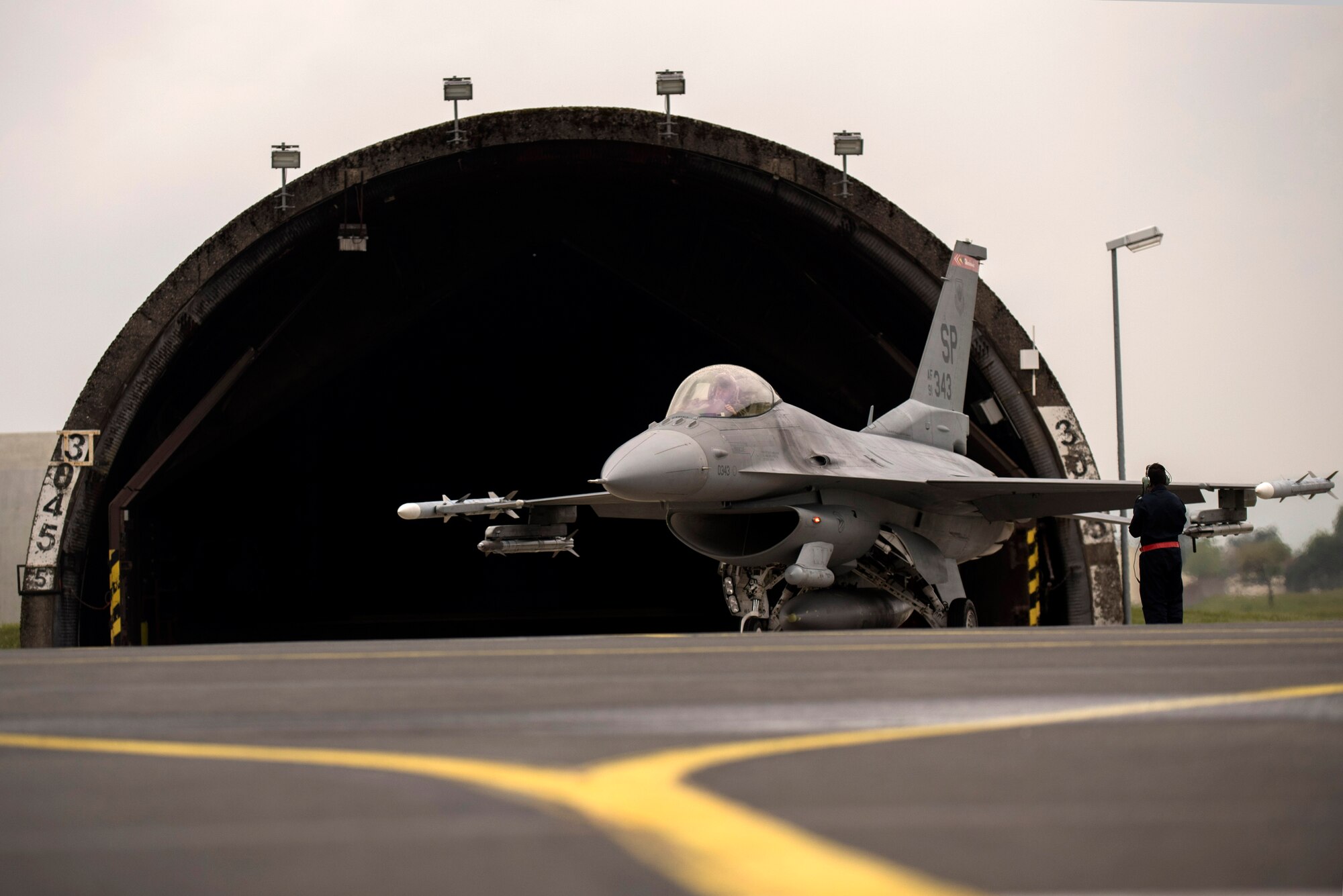 A U.S. Air Force F-16 Fighting Falcon assigned to the 480th Fighter Squadron prepares to taxi to the runway during a "14 front" launch at Spangdahlem Air Base, Germany, May 4th, 2017. From April 24 to May 5, the 480th FS and 52nd Aircraft Maintenance Squadron supported 26 sorties a day, 14 in the morning and 12 in the afternoon. This flying tempo is referred to as a, “14 turn 12,” and is a 16 percent increase over normal operations. During normal operations, it’s standard to launch a 12 turn 10, or 4 fewer sorties per day. Preparing and launching 14 aircraft in one go is referred to as a “14 front.” (U.S. Air Force photo by Preston Cherry)
