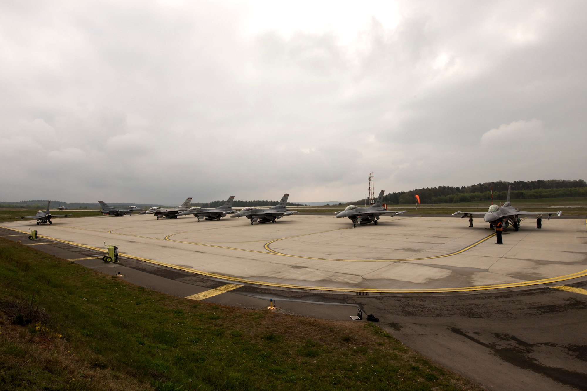 U.S. Air Force F-16 Fighting Falcons assigned to the 480th Fighter Squadron wait for inspections during a "14 front" launch at Spangdahlem Air Base, Germany, May 4th, 2017. From April 24 to May 5, the 480th FS and 52nd Aircraft Maintenance Squadron supported 26 sorties a day, 14 in the morning and 12 in the afternoon. This flying tempo is referred to as a, “14 turn 12,” and is a 16 percent increase over normal operations. During normal operations, it’s standard to launch a 12 turn 10, or 4 fewer sorties per day. Preparing and launching 14 aircraft in one go is referred to as a “14 front.” (U.S. Air Force photo by Preston Cherry)