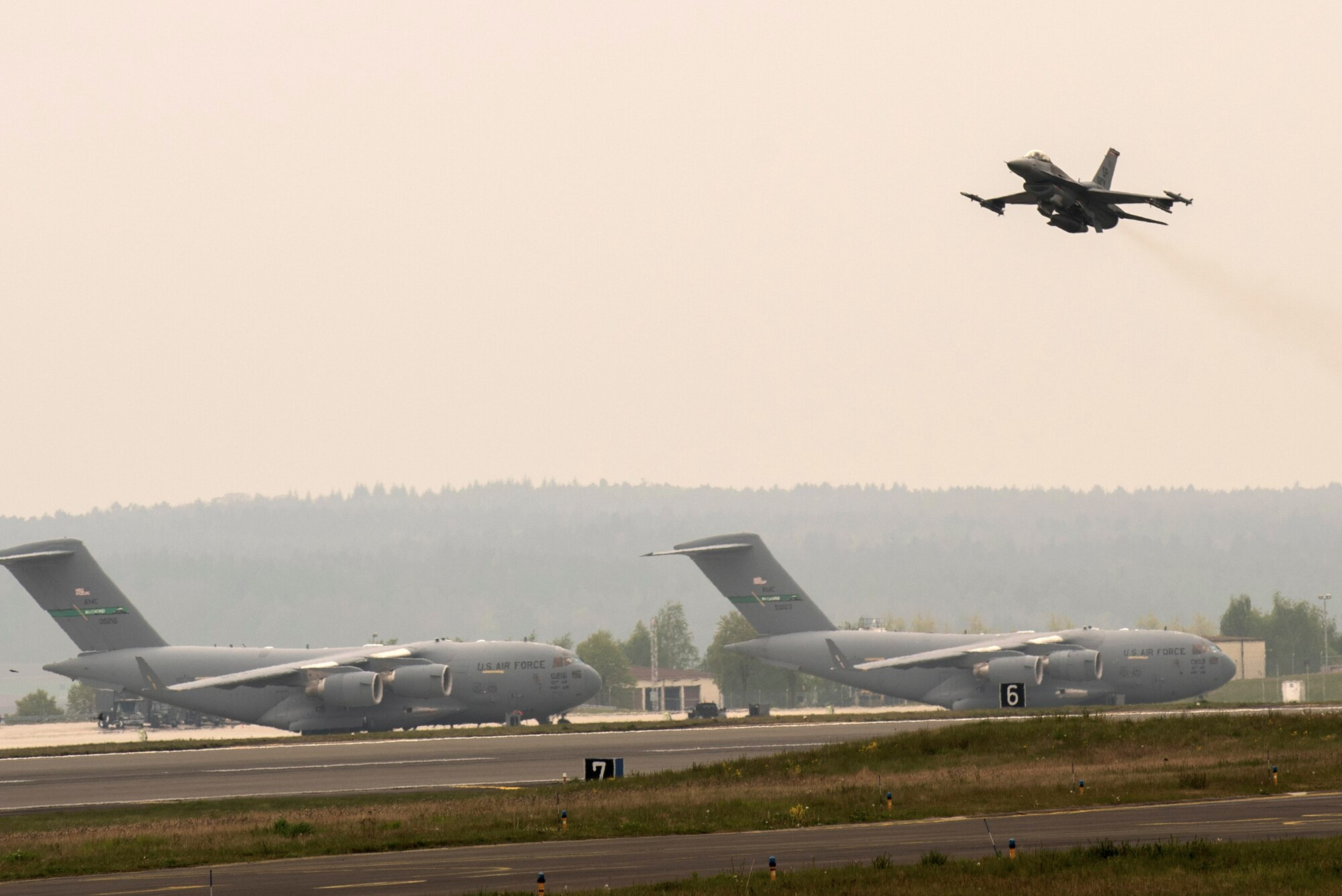 A U.S. Air Force F-16 Fighting Falcon assigned to the 480th Fighter Squadron takes off during a "14 front" launch at Spangdahlem Air Base, Germany, May 4th, 2017. From April 24 to May 5, the 480th FS and 52nd Aircraft Maintenance Squadron supported 26 sorties a day, 14 in the morning and 12 in the afternoon. This flying tempo is referred to as a, “14 turn 12,” and is a 16 percent increase over normal operations. During normal operations, it’s standard to launch a 12 turn 10, or 4 fewer sorties per day. Preparing and launching 14 aircraft in one go is referred to as a “14 front.” (U.S. Air Force photo by Preston Cherry)