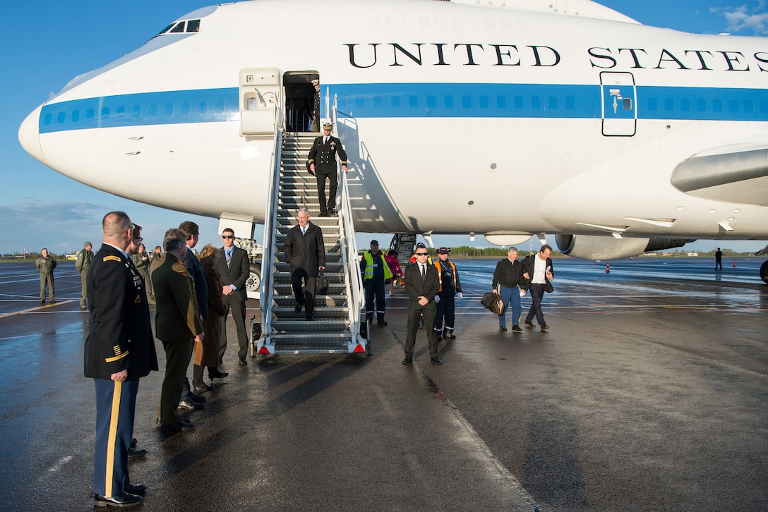 Defense Secretary Jim Mattis exiting a plane.