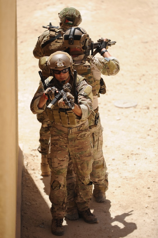 AMMAN, Jordan (May 8, 2017) Members of the U.S. Air Force Special Operation's 23 Special Tactics Squadron, Jordanian Armed Forces Special Task Force, and Italian Special Operations Wing, participating in small unit tactics, prepare to clear a building during drill at the King Abdullah II Special Operations Training Center, as part of Exercise Eager Lion. Eager Lion is an annual U.S. Central Command exercise in Jordan designed to strengthen military-to-military relationships between the U.S., Jordan and other international partners. This year's iteration is comprised of about 7,200 military personnel from more than 20 nations that will respond to scenarios involving border security, command and control, cyber defense and battlespace management. (U.S. Navy photo by Mass Communication Specialist 1st Class Matthew Cole/Released) 170508-N-ER662-118