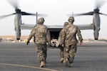 U.S. Army combat medics, with the 86th Combat Support Hospital, move a simulated casualty onto a MV-22 Osprey, during a joint training exercise with Marines from Marine Medium Tiltrotor Squadron - 364 (VMM-364), at Camp Arifjan, Kuwait, May 8, 2017. (U.S. Army Photo by Sgt. Christopher Bigelow)