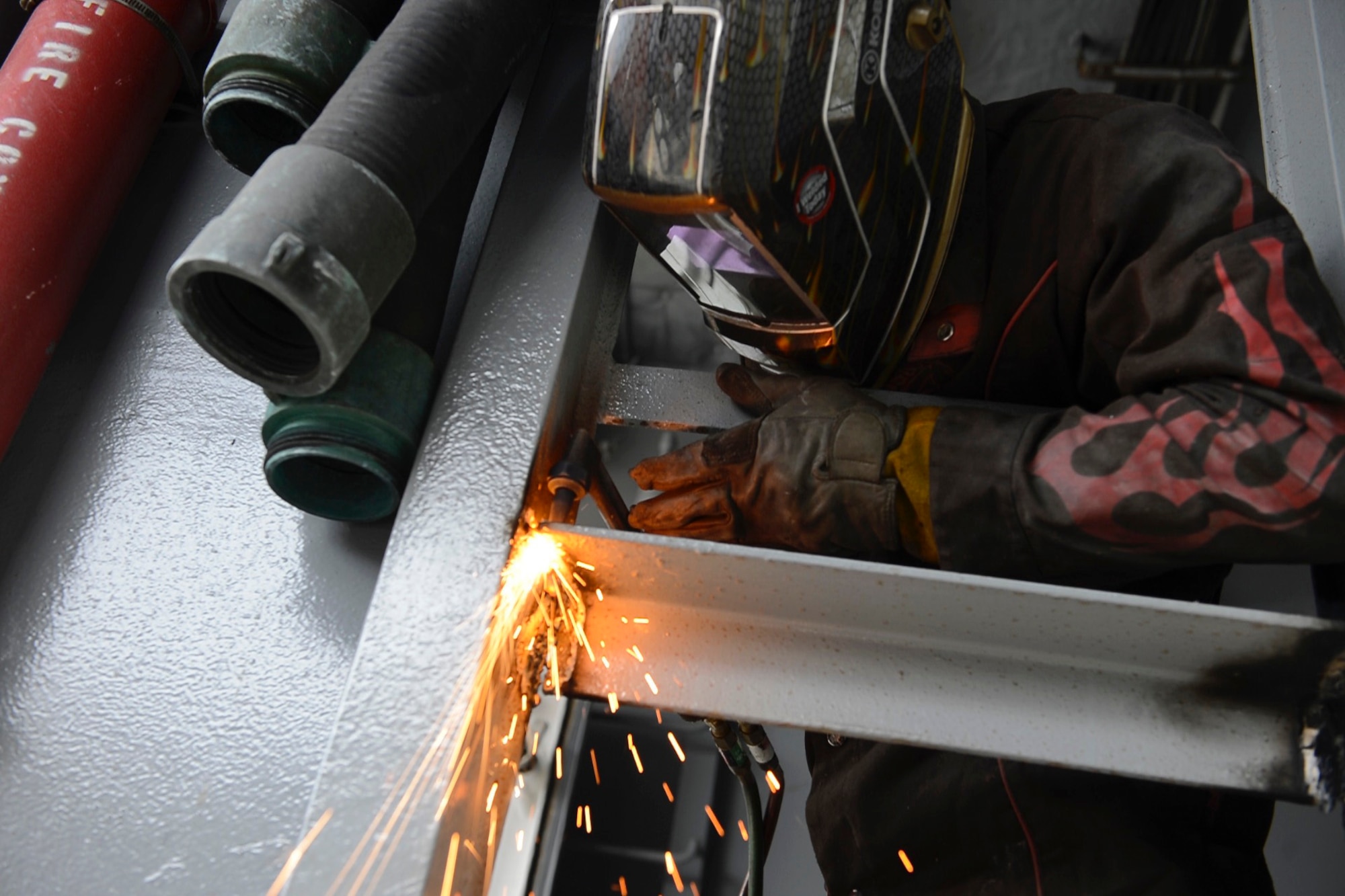U.S. Army Spc. Anthony Cole, 558th Transportation Company, 10th Battalion, 7th Transportation Brigade (Expeditionary) allied trade specialist, cuts away a metal brace aboard the General Frank S. Besson Jr. Logistics Support Vessel at Joint Base Langley-Eustis, Va., May 4, 2017. The welding shop ensures the sustainment of boats, repairing most types of torn or broken metal, keeping ships’ crew safe underway. (U.S. Air Force photo/Airman 1st Class Kaylee Dubois)
