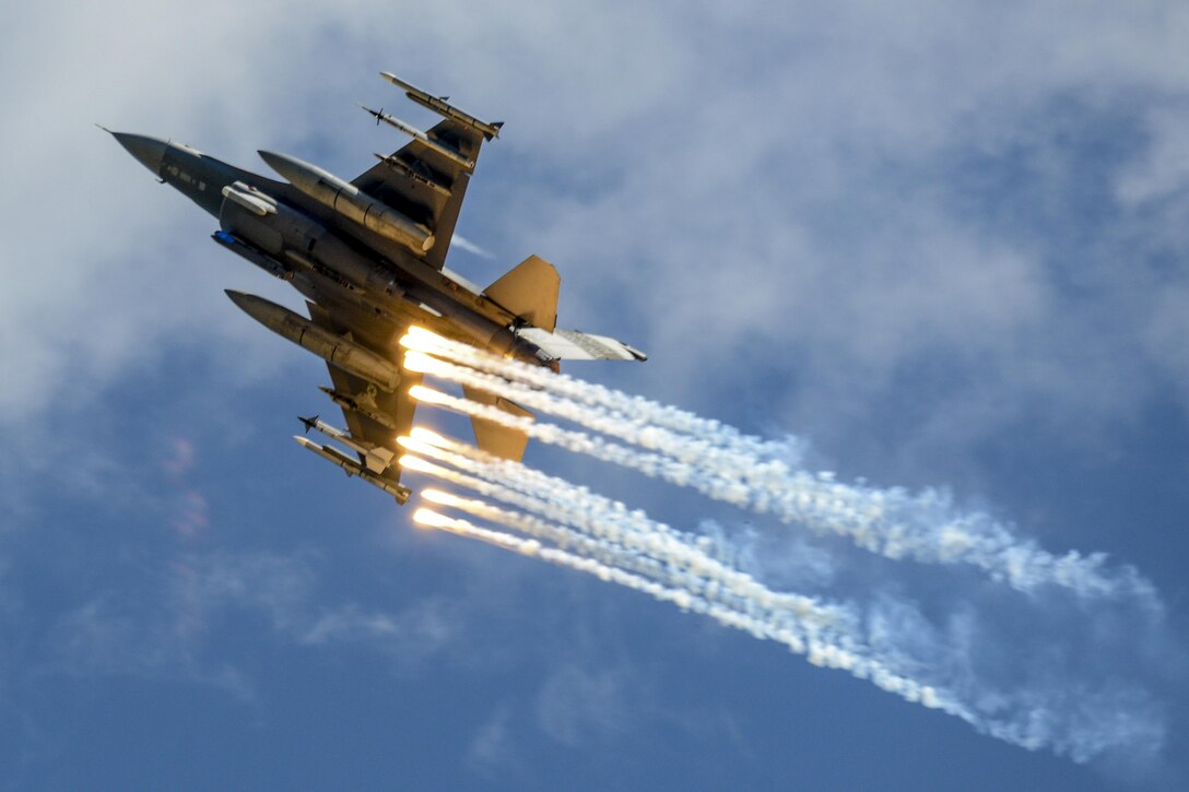 A U.S. Air Force F-16 Fighting Falcon assigned to the 169th Fighter Wing deploys  flares over McEntire Joint National Guard Base, South Carolina, May 6, 2017 during the South Carolina National Guard Air and Ground Expo. This expo is a combined arms demonstration showcasing the abilities of South Carolina National Guard Airmen and Soldiers while saying thank you for the support of fellow South Carolinians and the surrounding community. (U.S. Air National Guard photo/Tech. Sgt. Jorge Intriago)