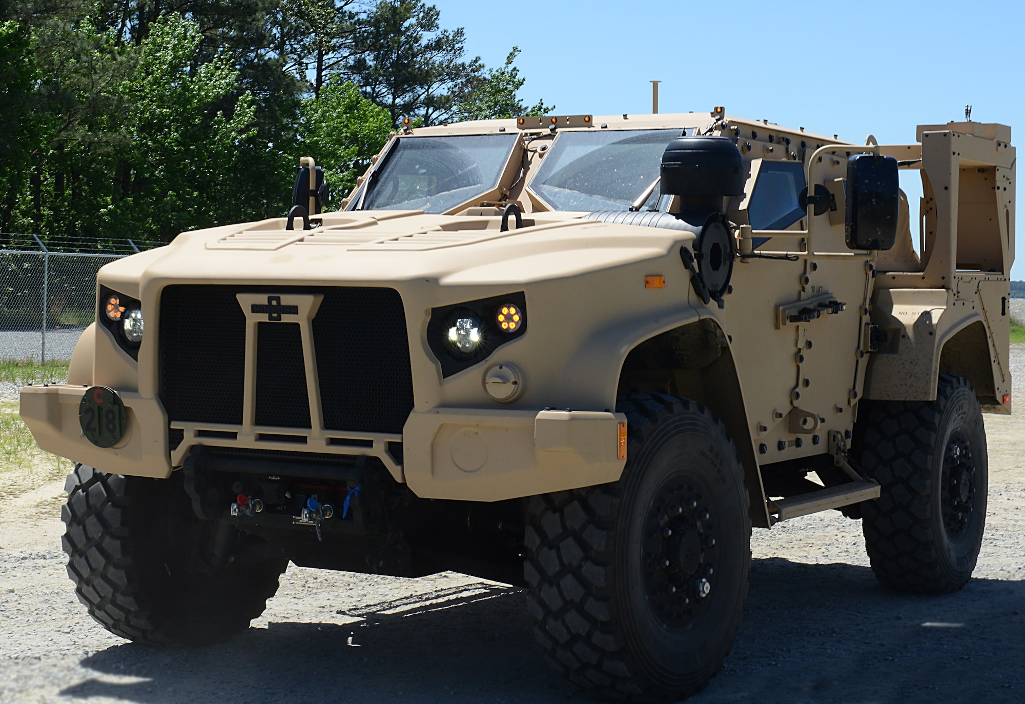 U.S. Army leaders from U.S. Army Training and Doctrine Command test drive a production model Joint Light Tactical Vehicle at Joint Base Langley-Eustis, Va., May 2, 2017. The JLTV is a tactical wheeled vehicle that includes hull designs built to optimize survivability against a full range of blast and ballistic threats. It was designed to bridge the capability gap in protection, performance and payload of the Humvee. (U.S. Air Force photo/Staff Sgt. Teresa J. Cleveland)