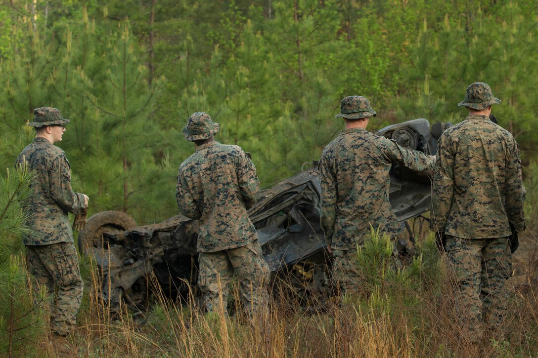 Marines examine the results of the detonation of a platter charge during a demolitions range at Fort A.P. Hill, Va., April 27, 2017. Marines conducted the training in preparation for an upcoming deployment and to increase confidence with the employment of demolition charges. The Marines are with 2nd Combat Engineer Battalion. (U.S. Marine Corps photo by Pfc. Abrey D. Liggins)