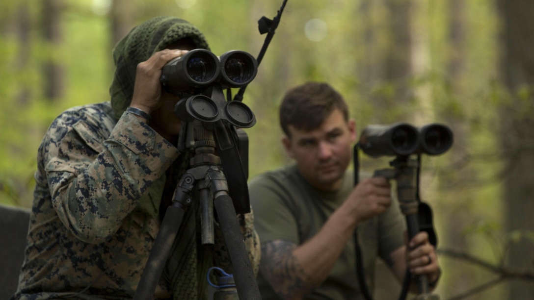 Marine instructors use binoculars to locate trainees during stalk training at Fort A.P. Hill, Va., April 26, 2017. Marines conducted the training in preparation for an upcoming deployment as a crisis response force. The Marines are with 2nd Battalion, 2nd Marine Regiment.