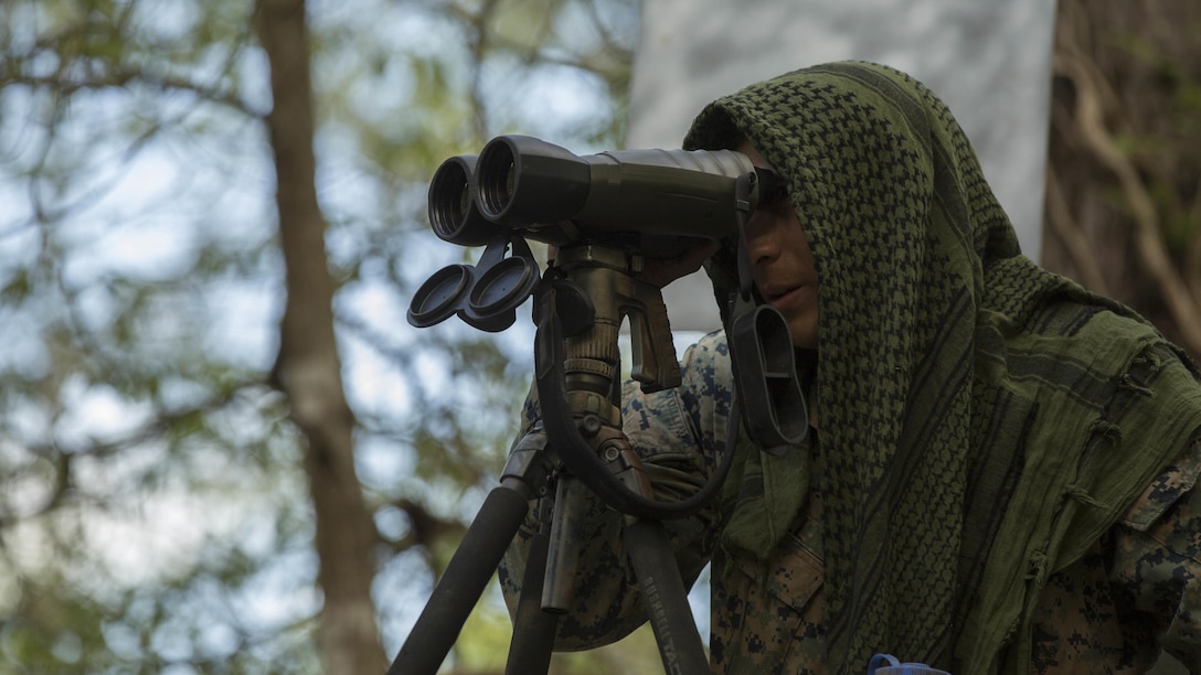 A Marine instructor observes an area in an attempt to locate trainees during stalk training at Fort A.P. Hill, Va., April 26, 2017. Marines conducted the training in preparation for an upcoming deployment as a crisis response force. The Marines are with 2nd Battalion, 2nd Marine Regiment. 