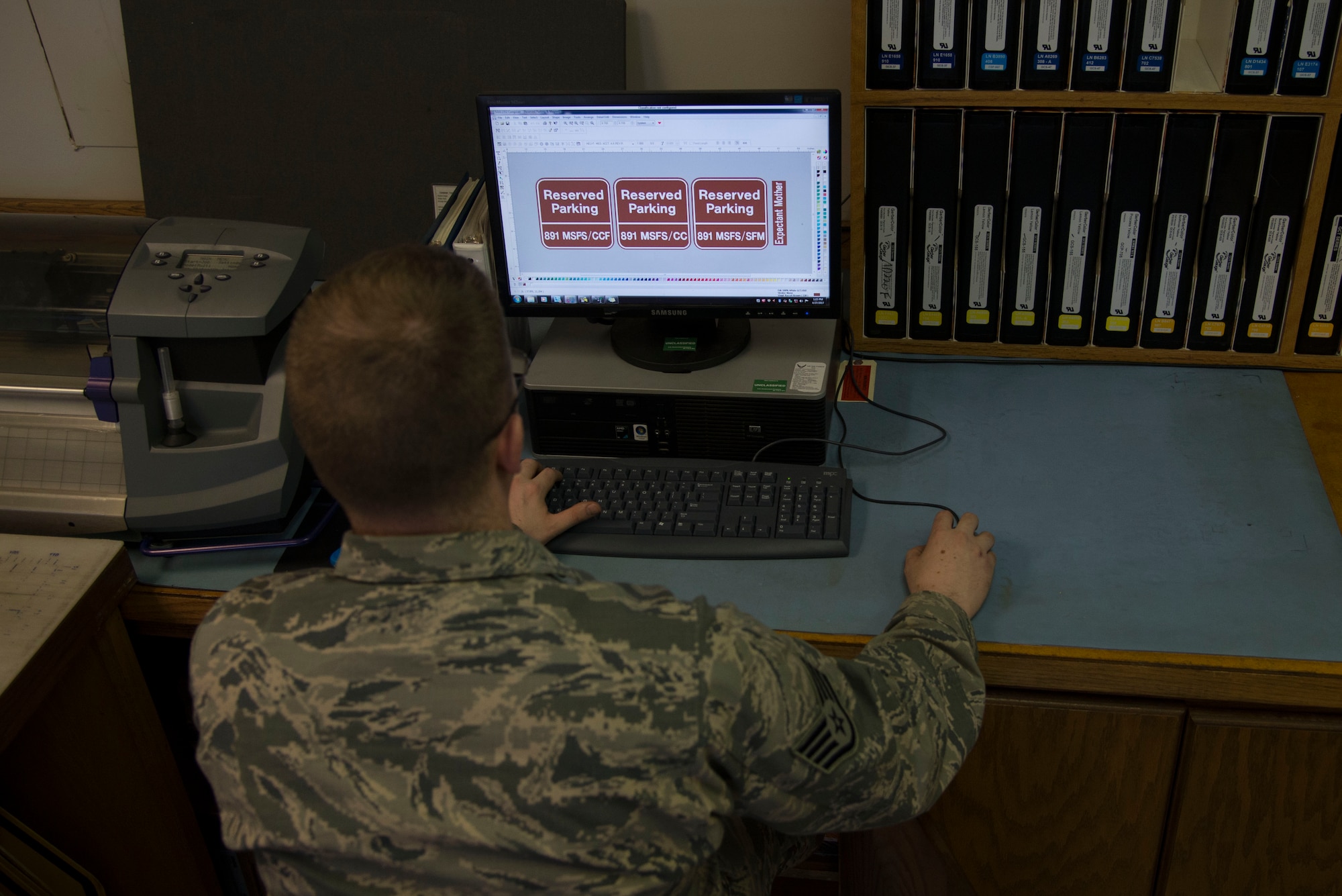Staff Sgt. Horace Hand, 5th Civil Engineer Squadron structural craftsman, creates a sign at the sign shop on Minot Air Force Base, N.D., April 27, 2017. Airmen assigned to the sign shop use design software to create templates used across the base and missile complex. (U.S. Air Force photo/Airman 1st Class Dillon Audit)