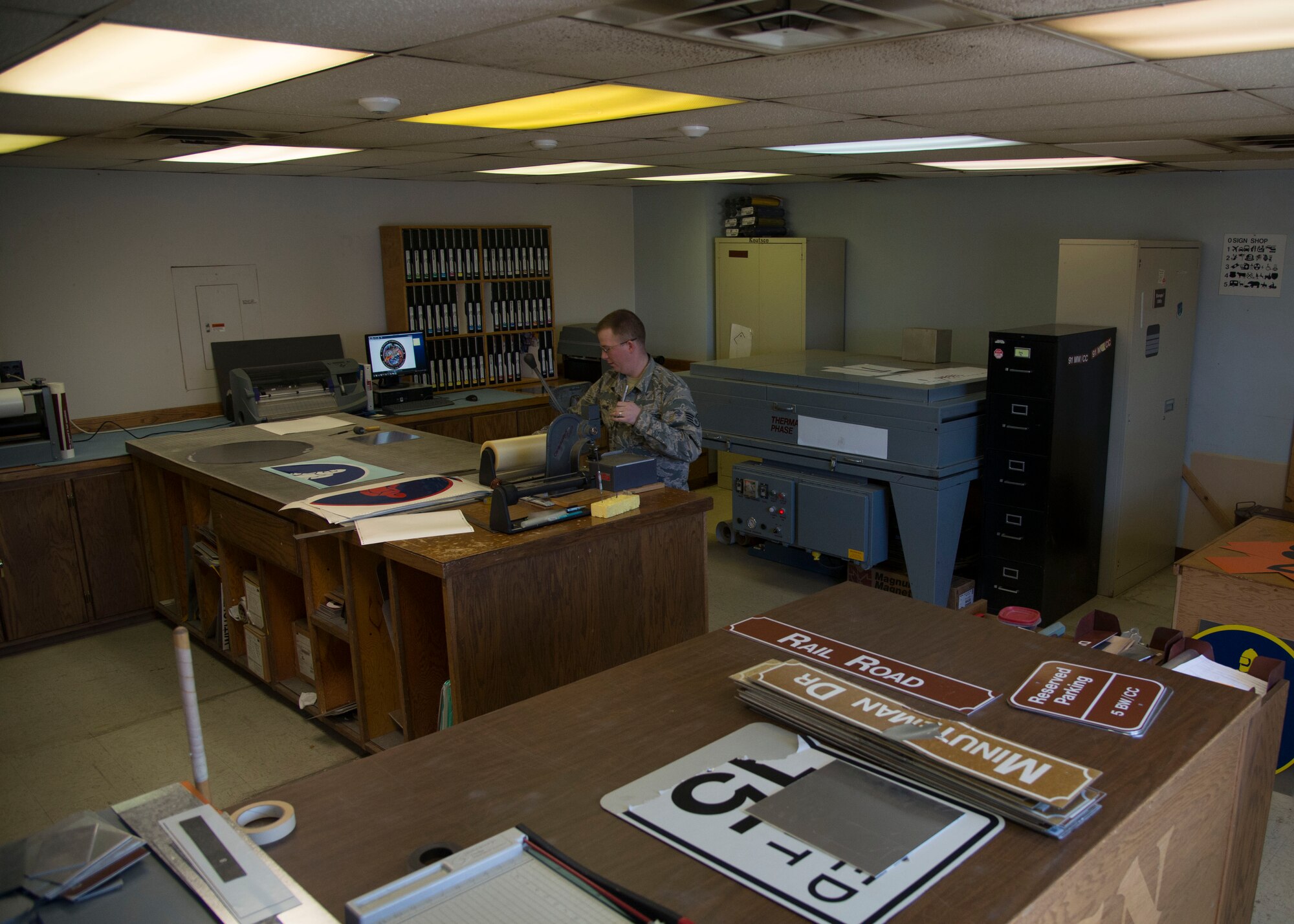 Staff Sgt. Horace Hand, 5th Civil Engineer Squadron structural craftsman, organizes signs at the sign shop on Minot Air Force Base, N.D., April 27, 2017. The sign shop maintains all government signs on base and within the missile complex. (U.S. Air Force photo/Airman 1st Class Dillon Audit)