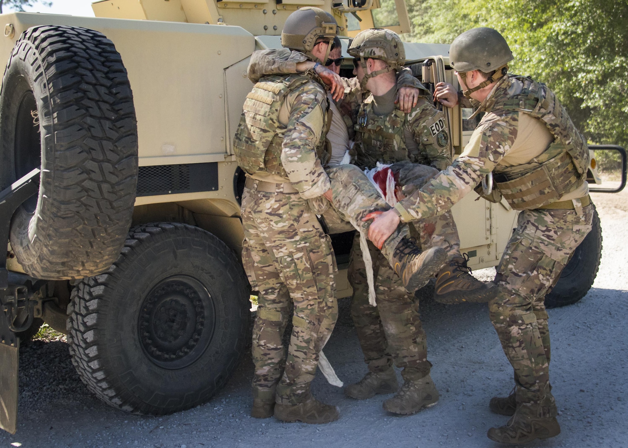 Airmen load a simulated victim into a vehicle to transport him for medical attention during a simulation as a part of the EOD Warfighter Challenge at Eglin Air Force Base, Fla., May 2. The challenge was a four-day, scenario-based, skills exchange between 17 EOD teams from across the Air Force. (U.S. Air Force photo/Cheryl Sawyers)