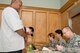 U.S. Air Force Reserve Senior Master Sgt. Jason Buck, aerospace medicine superintendent, 913th Aerospace Medical Squadron, reviews medical history for Darren Mercer during the Individual Ready Reserve (IRR) Muster at Little Rock Air Force Base, Ark., May 5, 2017. Mercer, who was a staff sergeant with the 19th Civil Engineer Squadron before transferring to IRR status about a year and a half ago, has two years left in IRR status before his Military Service Obligation (MSO) expires. (U.S. Air Force photo by Master Sgt. Jeff Walston/Released)